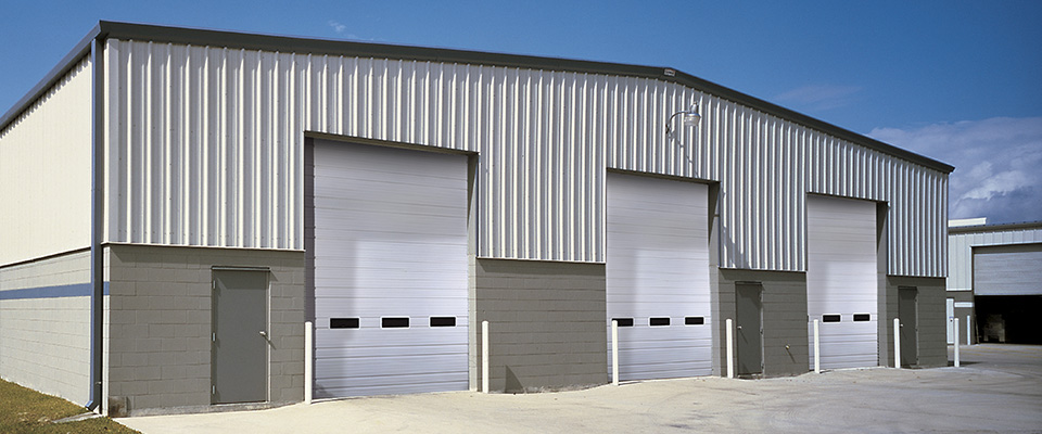 Overhead doors on a big warehouse shipping building